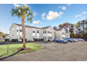 Condo building with ample parking and landscaping at 1943 Bent Grass Dr. # H, Myrtle Beach, SC 29575