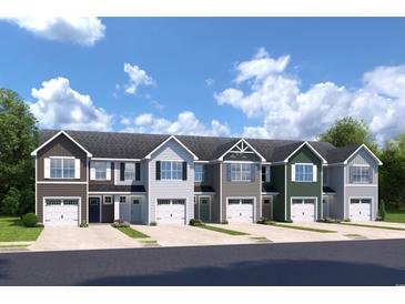 Five-unit townhome development showcasing modern design and attached garages at 2084 Palm Meadows Way # 496A, Conway, SC 29526