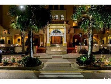 Elegant building exterior with palm trees and a grand entrance at 2600 N Ocean Blvd. # 1410, Myrtle Beach, SC 29577