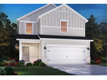 Two-story house with gray siding, white trim, and a two-car garage at 3070 Dover Branch Dr., Little River, SC 29566