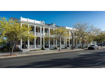 Brick townhouses with front porches and balconies at 965 Hackler St. # A, Myrtle Beach, SC 29577