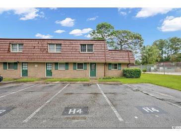 Brick condo building with parking and landscaping at 1025 Carolina Rd. # H4, Conway, SC 29526