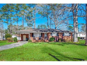 Brick ranch house with carport, mature trees, and a well-maintained lawn at 1100 Naomi Ave., Conway, SC 29526