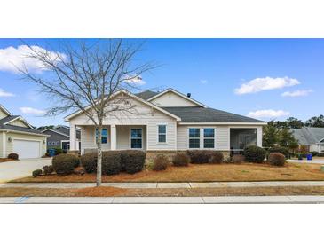 Charming one-story home with a screened porch and manicured lawn at 1901-B High St., Myrtle Beach, SC 29577