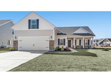 Newly constructed home with two-car garage and landscaped lawn at 245 Six Mile Creek Dr., Georgetown, SC 29440