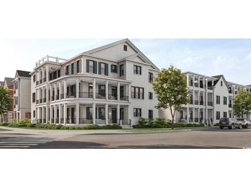 Three-story building with white brick exterior, balconies, and street view at 2931 Howard Ave. # A, Myrtle Beach, SC 29577