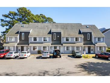 Attractive three-story building with ample parking at 3700 Golf Colony Lane # 24B, Little River, SC 29566