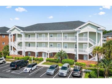 Three-story building with parking and landscaping at 3951 Gladiola Ct. # 204, Myrtle Beach, SC 29588