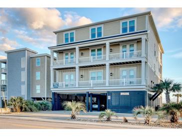 Three-story home with multiple balconies and attached garage at 4208 N Ocean Blvd., North Myrtle Beach, SC 29582