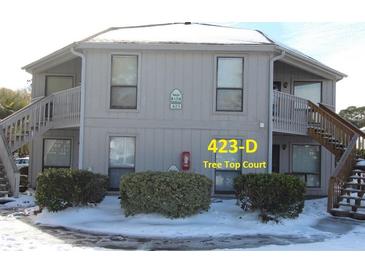 Snow covered exterior of a two story building with two staircases at 423 Tree Top Ct. # 23-D, Myrtle Beach, SC 29588