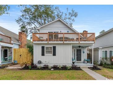 Charming two-story home with a deck and landscaped yard at 506-B Rosemary Ln., North Myrtle Beach, SC 29582