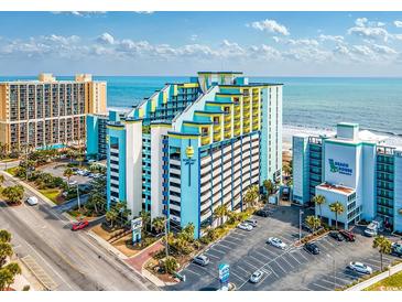 Aerial view of oceanfront resort, showing building, parking, and beach at 6804 N Ocean Blvd. # 1637, Myrtle Beach, SC 29572