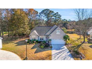 Attractive single-story home with landscaped yard and driveway at 116 Cobblestone Dr., Pawleys Island, SC 29585