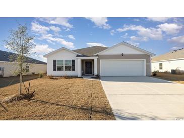 Single-story home with attached garage and neutral color palette at 3414 Ashridge Way, Conway, SC 29526