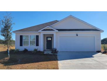 White house with a gray roof, blue door, and landscaped yard at 3489 Ashridge Way, Conway, SC 29526