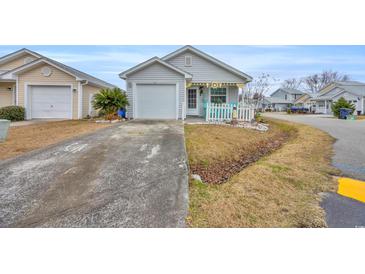 Cute cottage with attached garage and small front yard at 412 Chesterfield Ct., Myrtle Beach, SC 29577