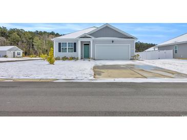 Gray house with a green door and snowy front yard at 426 Toledo St., Conway, SC 29526