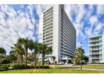 Oceanfront highrise building with palm trees and ample parking at 5511 N Ocean Blvd. # 309, Myrtle Beach, SC 29577