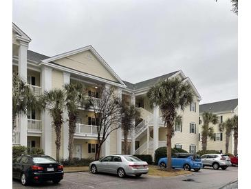 Attractive condo building with ample parking and landscaping at 601 N Hillside Dr. # 4235, North Myrtle Beach, SC 29582