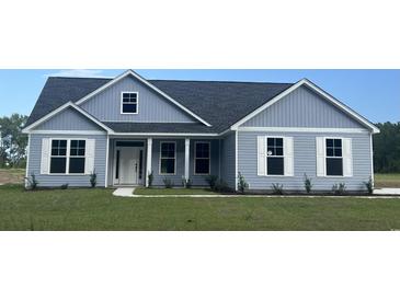 Newly constructed home with gray siding and a white trim at Tbd Hodges Rd., Conway, SC 29527