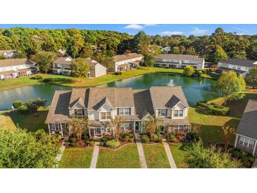 Aerial view of townhouses with a pond at 1010 Pinnacle Ln. # 1010, Myrtle Beach, SC 29577