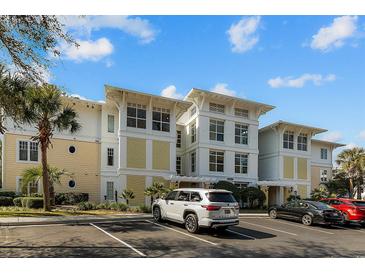 Luxury condo building with inviting architecture and ample parking at 1313 Villa Marbella Ct. # 101, Myrtle Beach, SC 29572