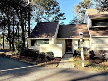 Inviting exterior of a charming condo with a well-maintained walkway at 314 Tall Pines Way # 6-34, Pawleys Island, SC 29585