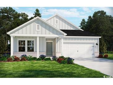 One-story home with white siding, black roof, and a two-car garage at 4328 Falls Oaks St., Myrtle Beach, SC 29579