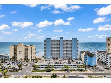 Oceanfront resort featuring a blue exterior, parking garage and picturesque ocean views at 1012 N Waccamaw Dr. # 204, Murrells Inlet, SC 29576