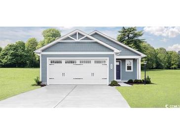 Newly built home with a two-car garage and a well-manicured lawn at 1080 Oak Meadow Dr., Conway, SC 29526