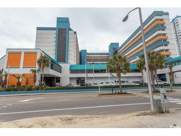Landmark oceanfront resort building with parking and palm trees at 1501 S Ocean Blvd. # 1542, Myrtle Beach, SC 29577