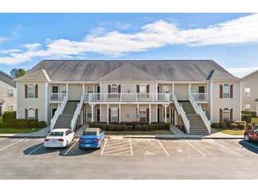 Two-story building with multiple units and ample parking at 209 Wando River Rd. # 10C, Myrtle Beach, SC 29579