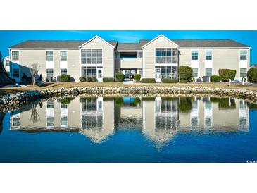 Two-story condo building with water view and landscaping at 2225 Essex Dr. # F, Surfside Beach, SC 29575