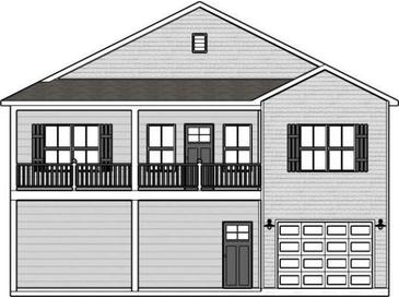 Two-story home with gray siding, balcony, and attached garage at 2426-B Park St., North Myrtle Beach, SC 29582