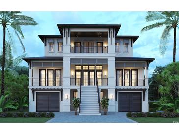 Stunning exterior view of a luxurious three-story home with balconies, complemented by lush tropical landscaping at 4702 N Ocean Blvd., Myrtle Beach, SC 29577