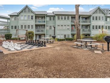 Enjoy resort-style living with chess, picnic tables, and grills at 5905 South Kings Hwy. # 5105-D, Myrtle Beach, SC 29575