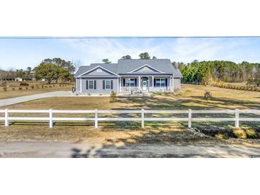 Gray house with white fence and landscaping at 1464 W G Rd., Conway, SC 29526