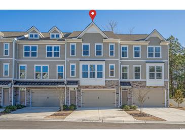 Three-story townhome with two-car garage and neutral color scheme at 2557 Pete Dye Dr. # 903, North Myrtle Beach, SC 29582