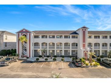 Two-story building exterior with parking and landscaping at 4518 N Plantation Harbour Dr. # G-1, Little River, SC 29566