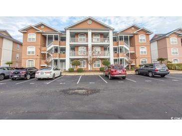 Three-story condo building with parking and landscaping at 4617 Lightkeepers Way # 9-I, Little River, SC 29566
