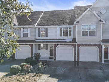 Two-story townhome with attached garage and landscaping at 537 Uniola Dr. # 537, Myrtle Beach, SC 29579