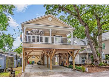 Two-story elevated beach house with wrap-around deck and spacious parking underneath at 6001 - 1243 S Kings Hwy., Myrtle Beach, SC 29575