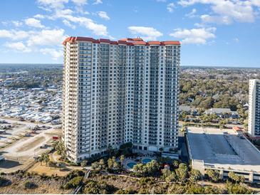 Aerial view of a high-rise building with oceanfront location and pool at 8500 Margate Circle # 606, Myrtle Beach, SC 29572