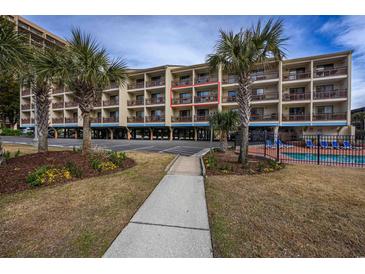 Oceanfront building, featuring a walkway, landscaping, and a pool at 202 75Th Ave. N # 5604/5605, Myrtle Beach, SC 29572
