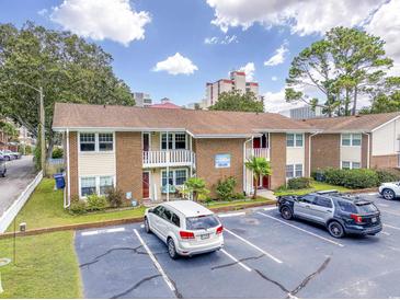 Brick building with ample parking and nearby ocean views at 7602 Porcher Dr. # C, Myrtle Beach, SC 29572