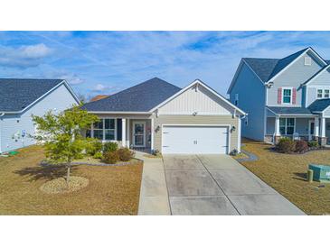 Attractive one-story house with a two-car garage and well-manicured lawn at 1325 Cascarilla Ct., Myrtle Beach, SC 29579