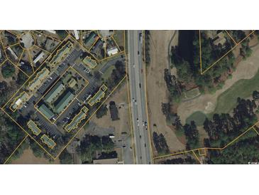 Aerial view of property showing community layout, parking, proximity to a highway, and adjacent golf course at 1432 Highway 544, Conway, SC 29526