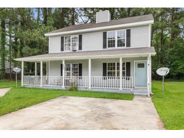 Charming two-story home with a welcoming front porch and well-maintained lawn at 207 Townes Ct., Myrtle Beach, SC 29588