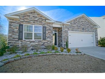 Charming one-story home with stone exterior and two-car garage at 240 Pin Oak Dr., Murrells Inlet, SC 29576