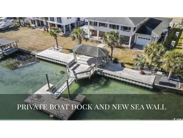 Waterfront home featuring a private boat dock and a new sea wall at 3545 Marion Ln., Murrells Inlet, SC 29576